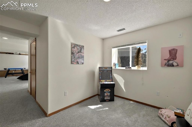 9025 Rochester Dr, Colorado Springs, CO 80920 - game room featuring carpet flooring, baseboards, and a textured ceiling