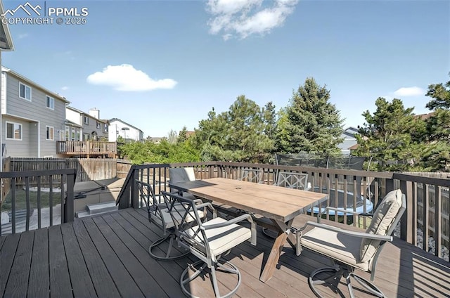 9025 Rochester Dr, Colorado Springs, CO 80920 - wooden deck featuring outdoor dining space and a residential view