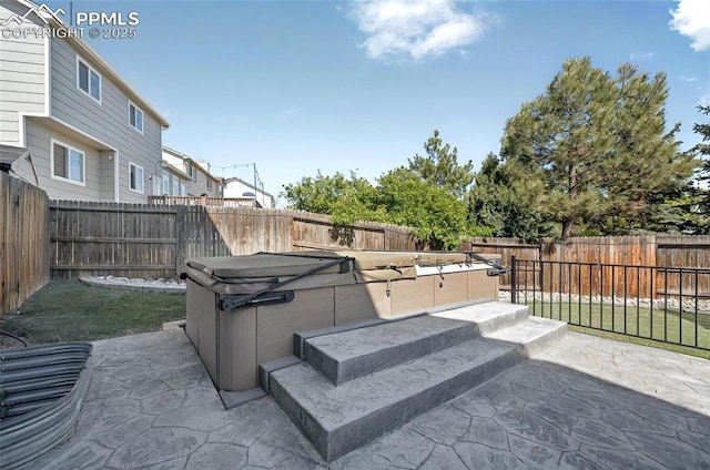 9025 Rochester Dr, Colorado Springs, CO 80920 - view of patio with a hot tub and a fenced backyard