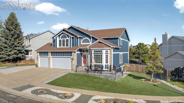 9025 Rochester Dr, Colorado Springs, CO 80920 - view of front of house featuring concrete driveway, board and batten siding, and a garage