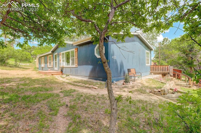 455 Clio Ave, Palmer Lake, CO 80133 - view of side of property with a deck