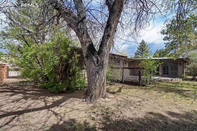 view of yard featuring fence