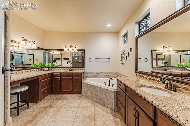 full bath featuring tile patterned floors, a sink, and a bath