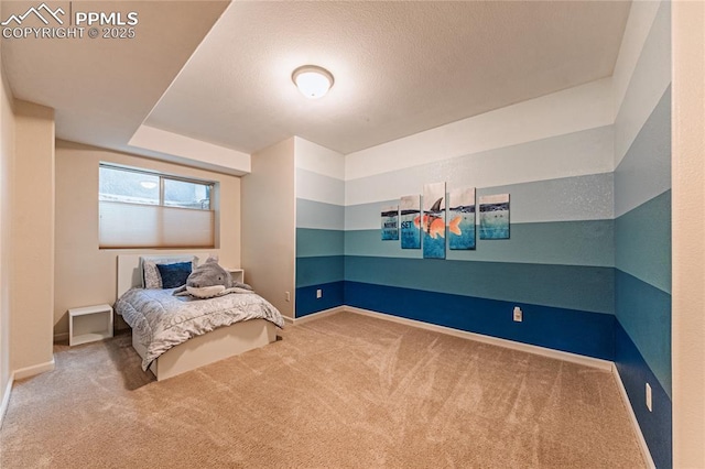 carpeted bedroom featuring baseboards