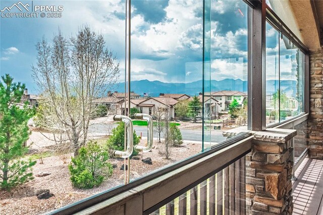 balcony with a residential view and a mountain view