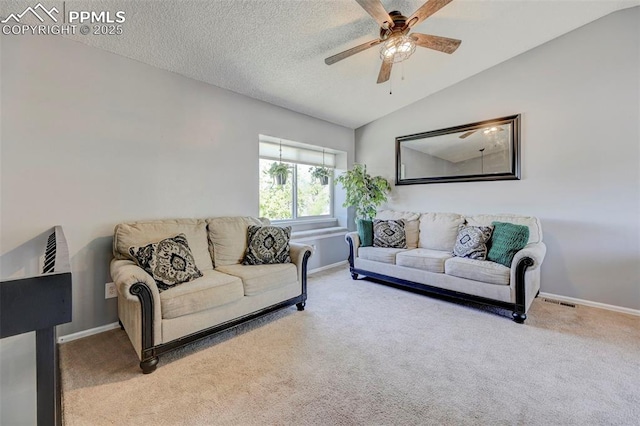 living area with ceiling fan, carpet flooring, and baseboards