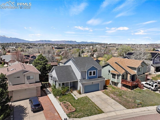 aerial view featuring a mountain view and a residential view
