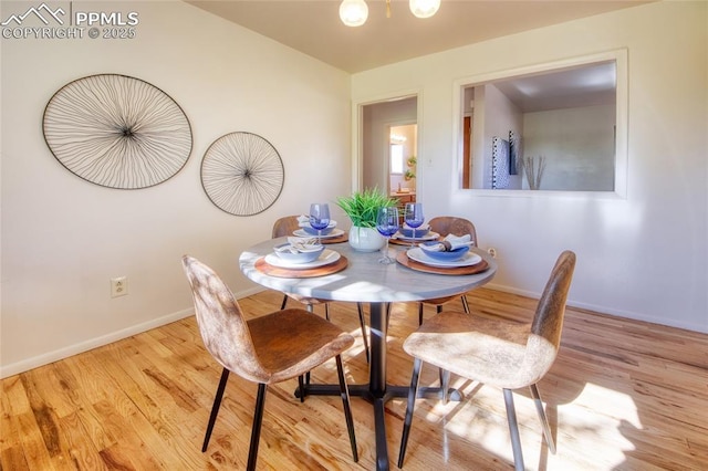 1227 Holmes Dr, Colorado Springs, CO 80909 - dining area featuring wood finished floors and baseboards