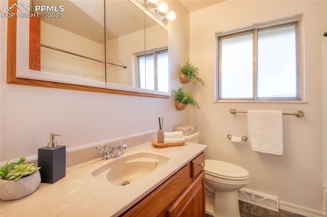 1227 Holmes Dr, Colorado Springs, CO 80909 - bathroom with toilet and vanity