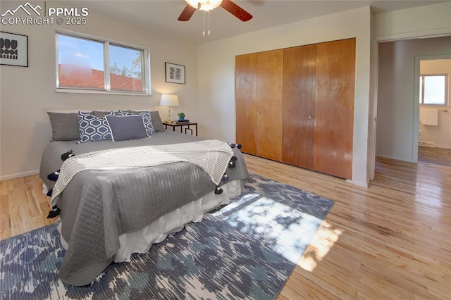 1227 Holmes Dr, Colorado Springs, CO 80909 - bedroom with a closet, light wood-type flooring, baseboards, and ceiling fan