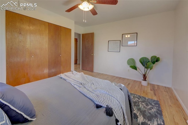 1227 Holmes Dr, Colorado Springs, CO 80909 - bedroom featuring wood finished floors, a closet, baseboards, and a ceiling fan