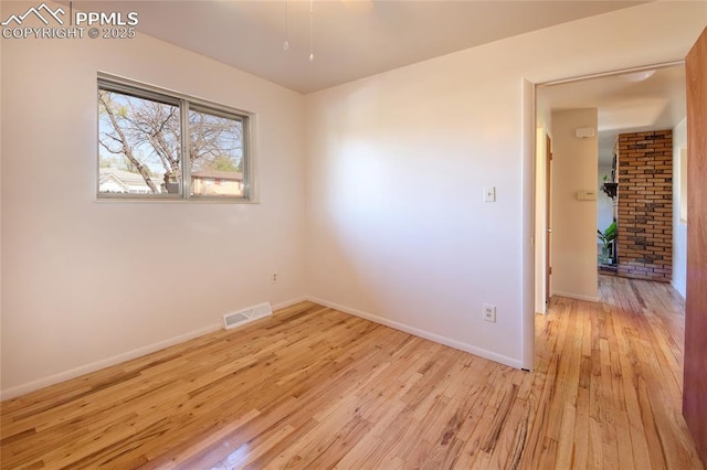 1227 Holmes Dr, Colorado Springs, CO 80909 - spare room featuring hardwood / wood-style floors and baseboards