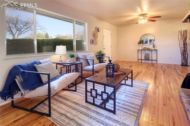 1227 Holmes Dr, Colorado Springs, CO 80909 - living room with a ceiling fan, hardwood / wood-style flooring, and baseboards