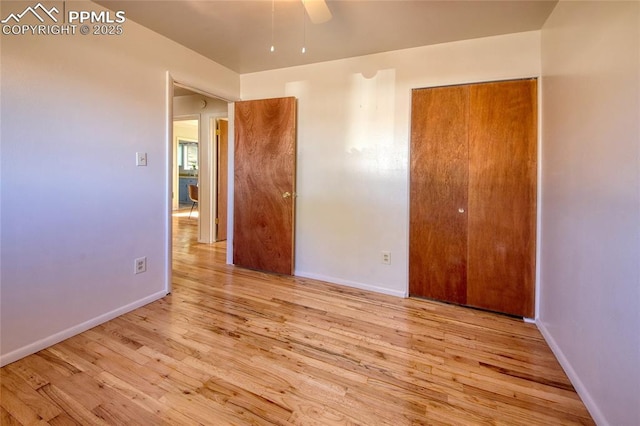 1227 Holmes Dr, Colorado Springs, CO 80909 - unfurnished bedroom featuring wood finished floors, baseboards, and a closet