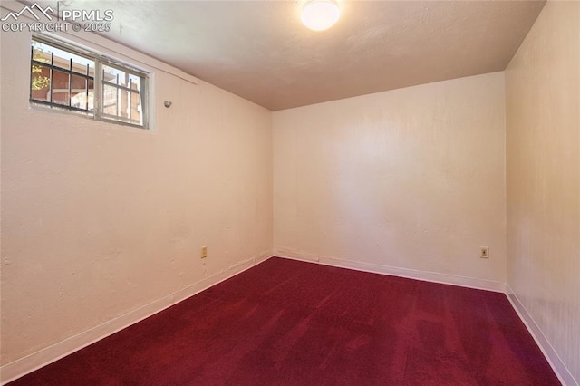 1227 Holmes Dr, Colorado Springs, CO 80909 - spare room with dark carpet and baseboards