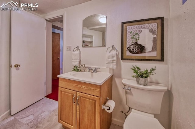 1227 Holmes Dr, Colorado Springs, CO 80909 - bathroom featuring toilet and vanity