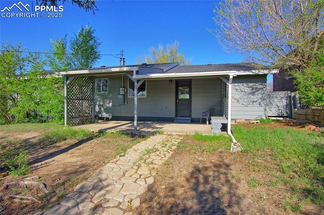1227 Holmes Dr, Colorado Springs, CO 80909 - back of house with a porch