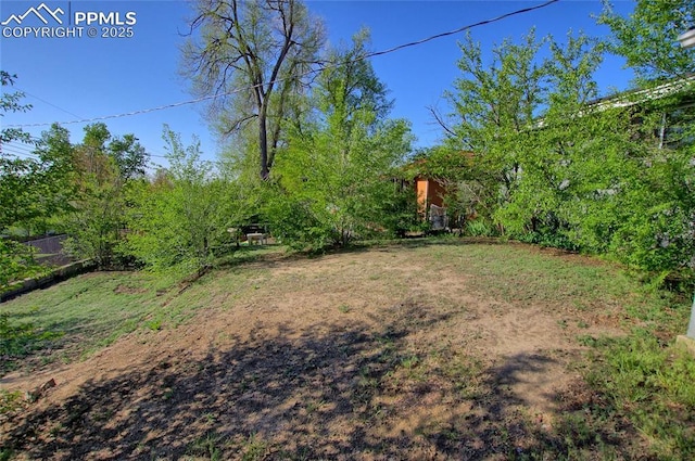 1227 Holmes Dr, Colorado Springs, CO 80909 - view of yard with fence