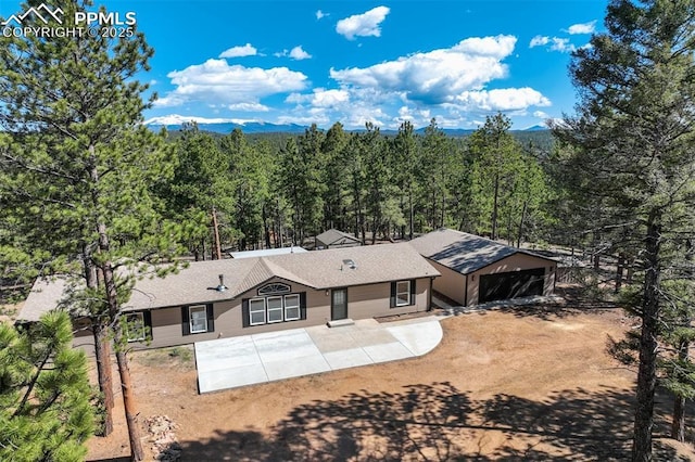 869 Kiowa Rd, Florissant, CO 80816 - aerial view of property and surrounding area with a heavily wooded area