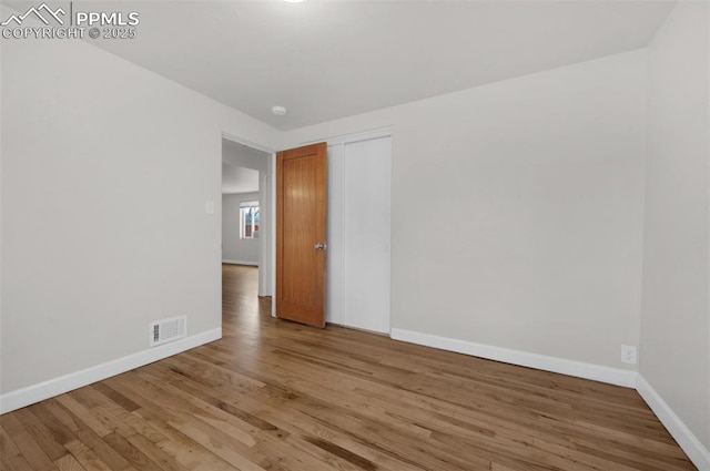 1229 E Caramillo St, Colorado Springs, CO 80909 - unfurnished room with baseboards and wood finished floors