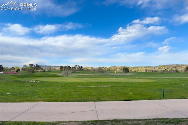 1229 E Caramillo St, Colorado Springs, CO 80909 - view of property's community featuring view of golf course and a yard