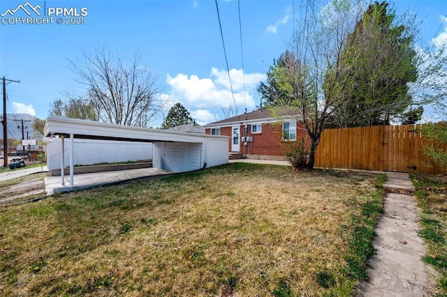 1229 E Caramillo St, Colorado Springs, CO 80909 - view of yard with a carport