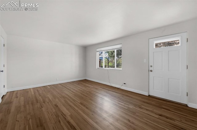 1229 E Caramillo St, Colorado Springs, CO 80909 - foyer entrance with wood finished floors and baseboards