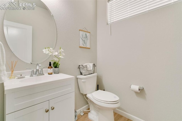 3111 Youngheart Way, Castle Rock, CO 80109 - bathroom featuring toilet, wood finished floors, vanity, and baseboards