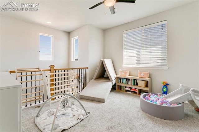 3111 Youngheart Way, Castle Rock, CO 80109 - recreation room with carpet floors, ceiling fan, and washer / clothes dryer