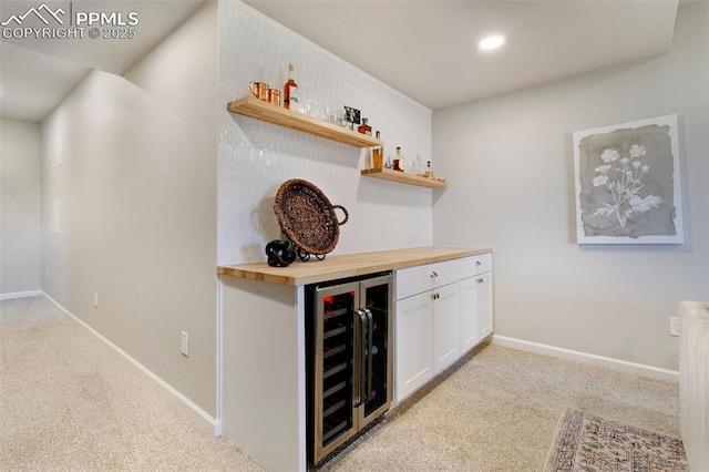 3111 Youngheart Way, Castle Rock, CO 80109 - indoor dry bar with beverage cooler, light colored carpet, baseboards, and recessed lighting