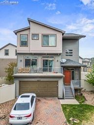 contemporary home featuring an attached garage and driveway