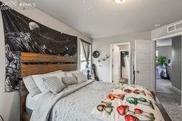 bedroom featuring visible vents