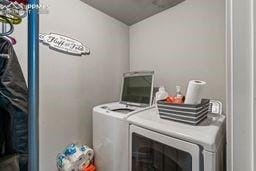 laundry room featuring laundry area and washing machine and dryer