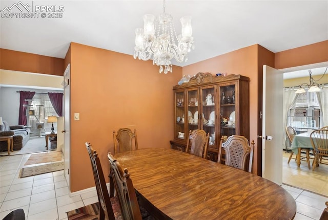 6820 Dauntless Ct, Colorado Springs, CO 80919 - dining space featuring tile patterned floors and an inviting chandelier