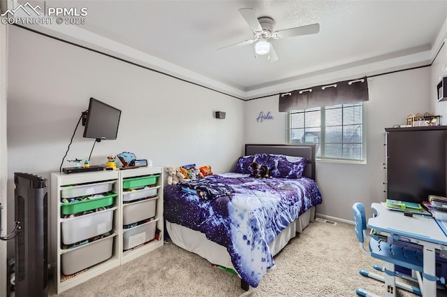 carpeted bedroom with a ceiling fan