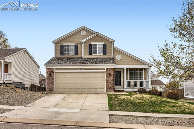 traditional-style home featuring a porch, driveway, a garage, brick siding, and a front lawn