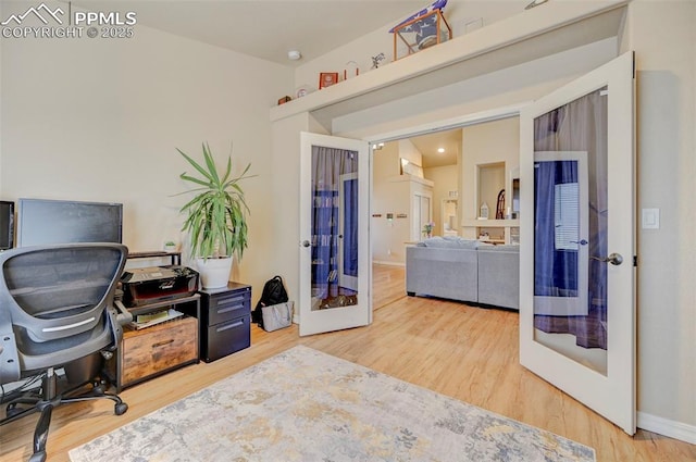 office featuring french doors, baseboards, and wood finished floors