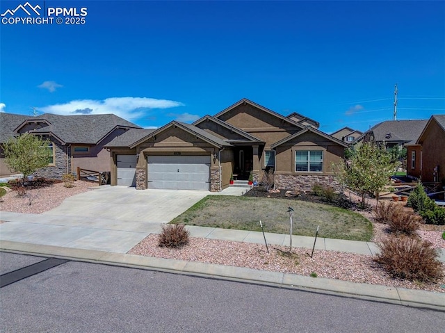 craftsman house with a garage, stucco siding, driveway, and stone siding