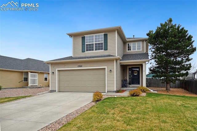traditional-style house featuring concrete driveway, a garage, fence, and a front lawn