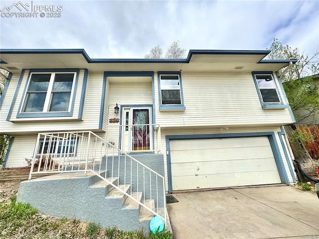 2706 N Chestnut St, Colorado Springs, CO 80907 - split foyer home featuring an attached garage and driveway
