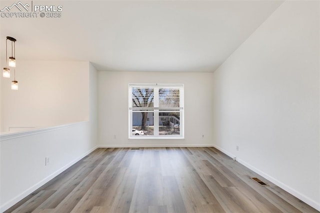 2706 N Chestnut St, Colorado Springs, CO 80907 - empty room with wood finished floors and baseboards