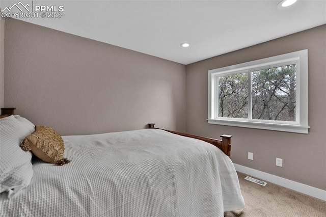 carpeted bedroom with visible vents, recessed lighting, and baseboards