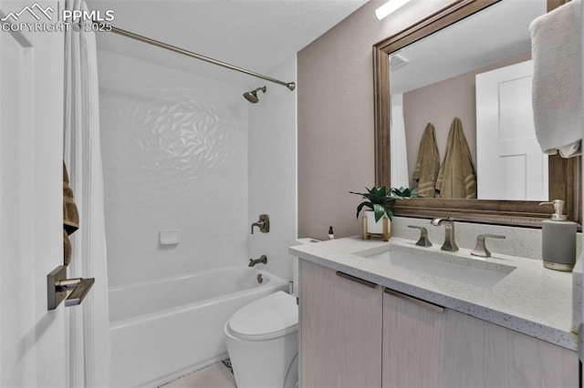 full bathroom featuring vanity, bathing tub / shower combination, and toilet