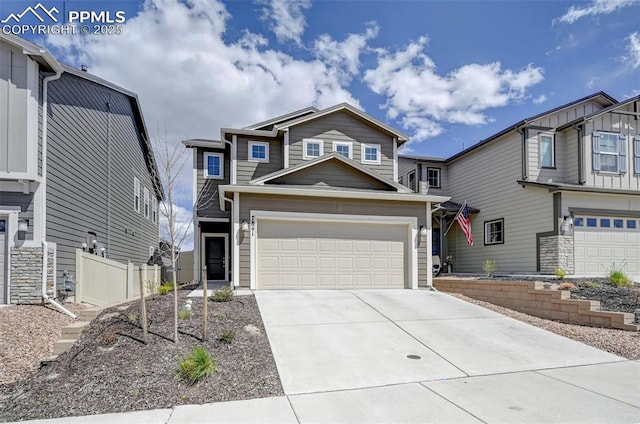 traditional home with an attached garage, fence, and driveway