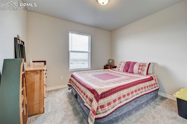 carpeted bedroom with baseboards