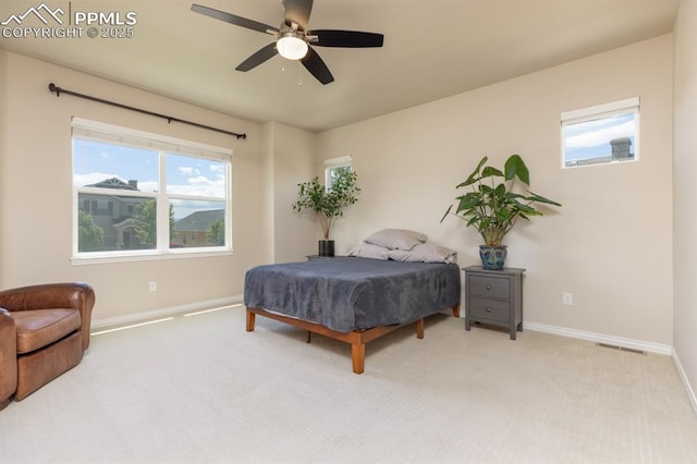 1849 Mud Hen Dr, Colorado Springs, CO 80921 - carpeted bedroom with baseboards and a ceiling fan