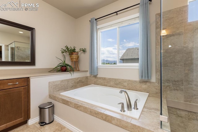 1849 Mud Hen Dr, Colorado Springs, CO 80921 - full bathroom with a tile shower, a garden tub, and tile patterned floors