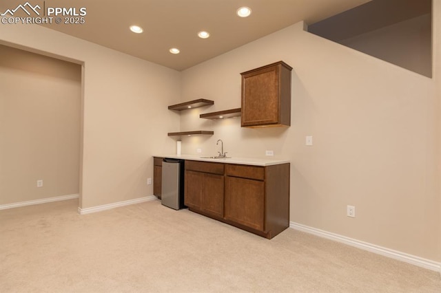 1849 Mud Hen Dr, Colorado Springs, CO 80921 - indoor wet bar with light carpet, recessed lighting, refrigerator, and baseboards