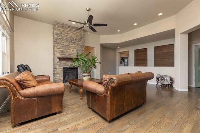 1849 Mud Hen Dr, Colorado Springs, CO 80921 - living room featuring ceiling fan, wood finished floors, a fireplace, recessed lighting, and baseboards