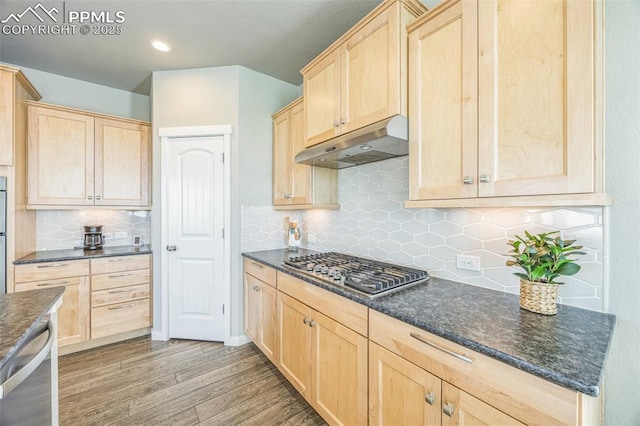kitchen featuring under cabinet range hood, light brown cabinets, appliances with stainless steel finishes, and recessed lighting